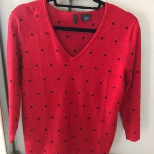 Red sweater with black embroidered dots